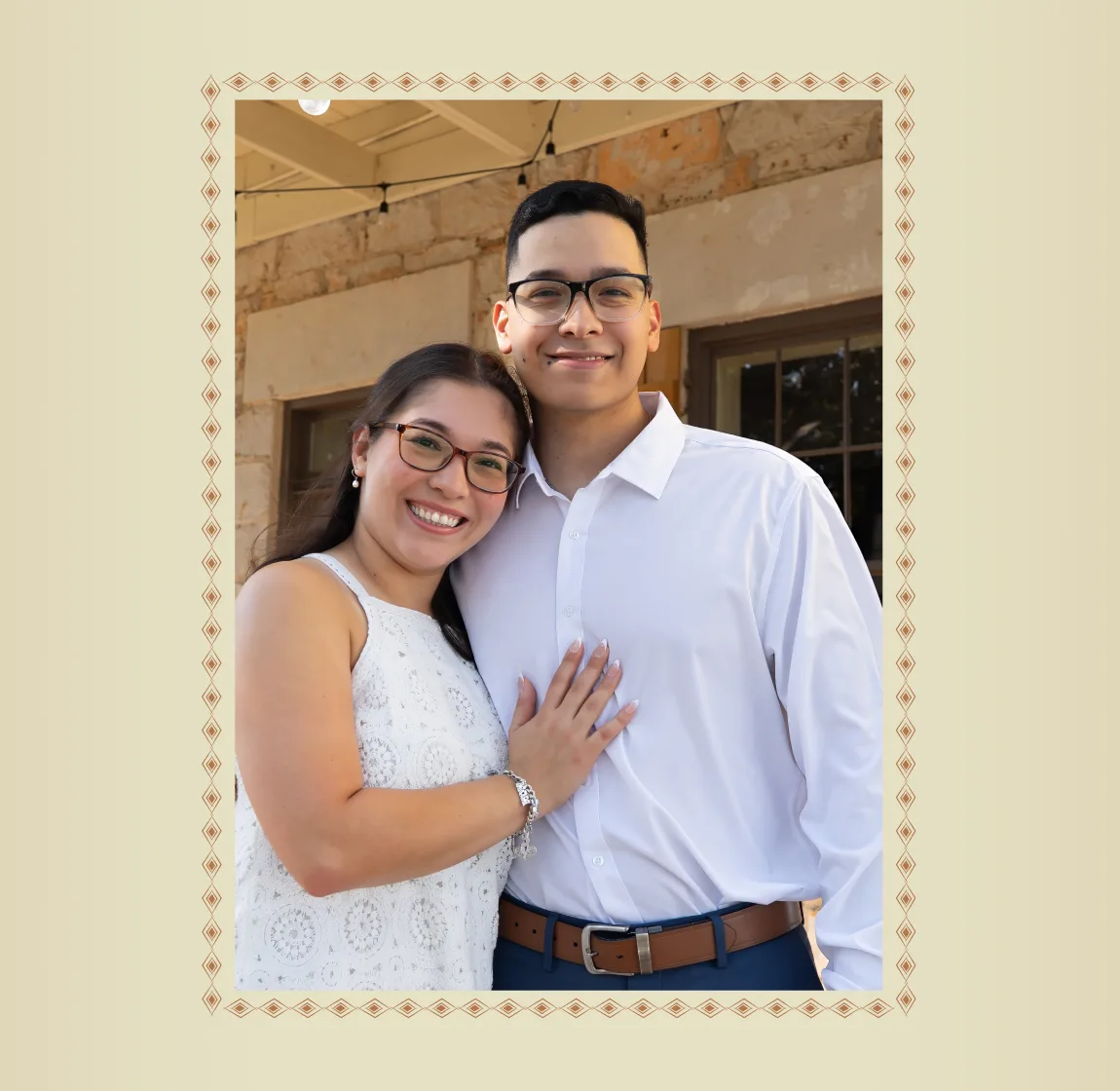 A couple at Aue Station framed by a decorative brand border