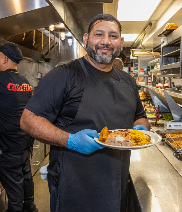 A Casa Rio chef plating food in the kitchen